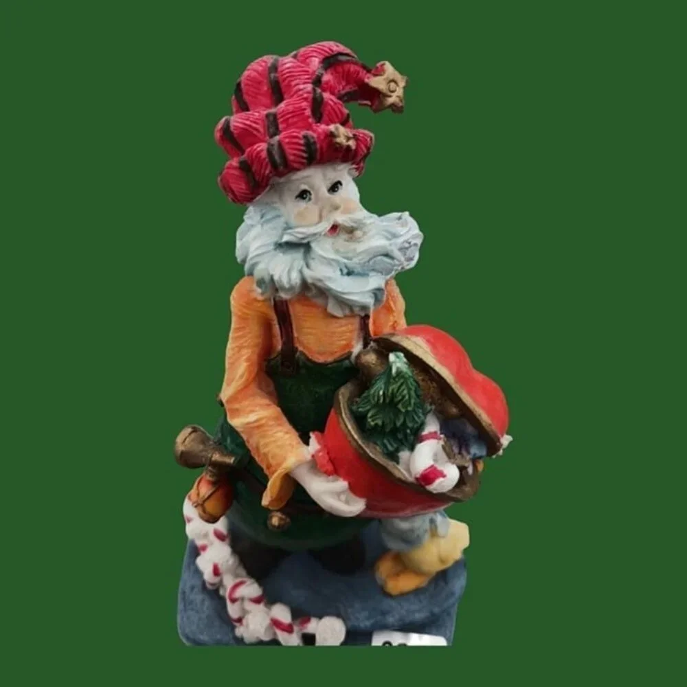Santa claus figurine with gift and duck